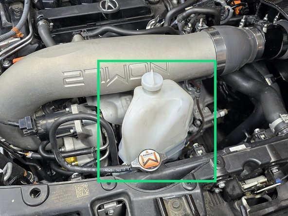 This may take a little bit of effort the first time. You will feel a "pop" when the tank is free from the mounting bracket