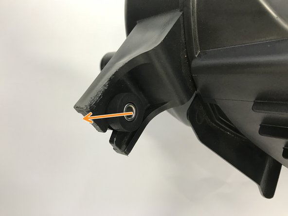 Identify one of the OE rubber mounts and remove the OE bolt (the bolt should be loose in the mount)
