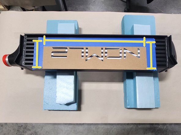 When placing the stencil over the existing logo, ensure the stencil is aligned properly by confirming that only white paint is visible
