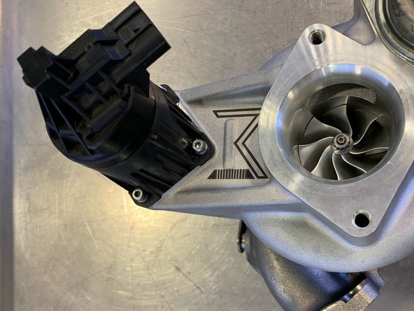 Position the Electronic Wastegate as shown
