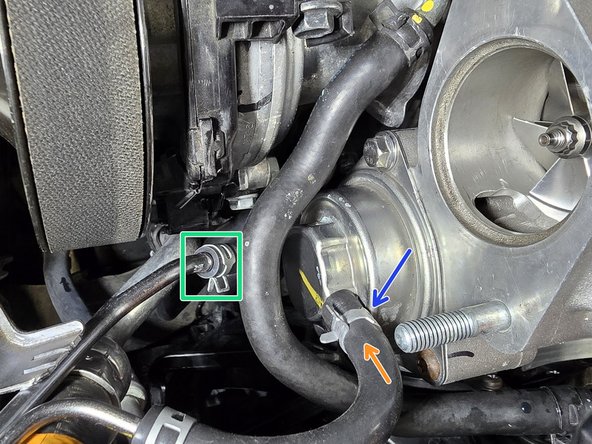 Place OE line over vacuum bracket barb as shown. Using pliers, pull OE clamp up to secure