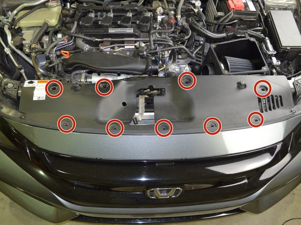 Carefully pry the 9 plastic clips open with a flat head screw driver