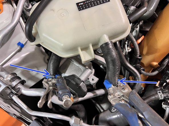 Use two vice grips with blue tape on the jaw ends to pinch off the coolant hoses. Put one on each hose about 3-6&quot; away from the barb