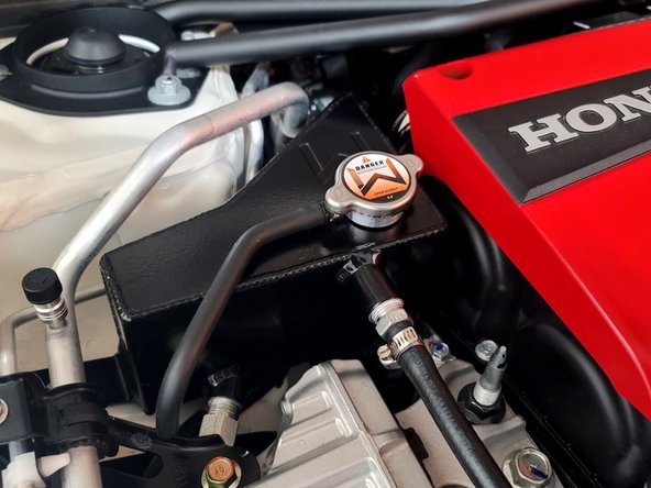 Make sure lower hose does not touch side motor mount bracket when it's installed later