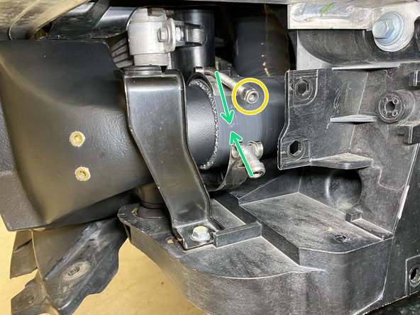 Place the T-Bolt clamp as shown and tighten with a 10mm socket and ratchet until the silicone bulges slightly