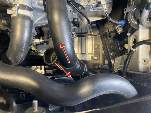 Slide the rubber hose off the bottom end of the cold pipe