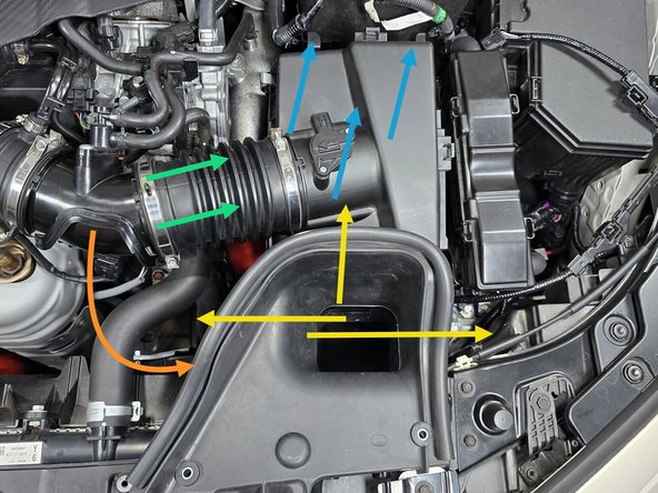 The airbox is still connected to the chassis with a rubber grommet and stud underneath the intake inlet in the area shown