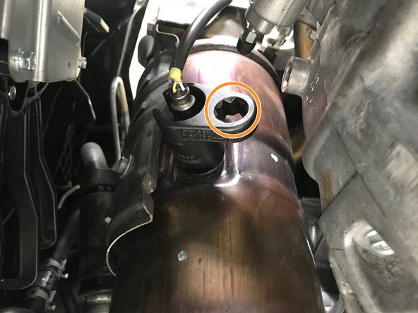 Use the ratchet wrench in the specialty socket to remove the O2 sensor