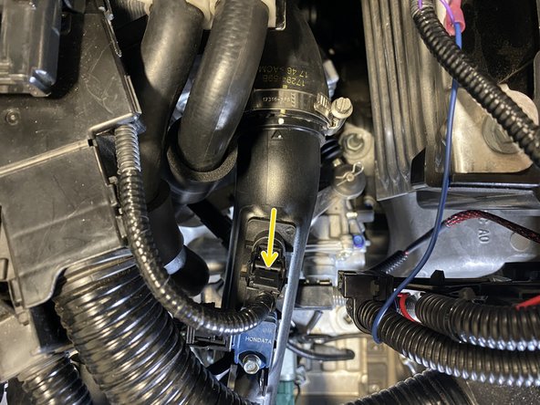 Un-clip the wiring from the temperature sensor