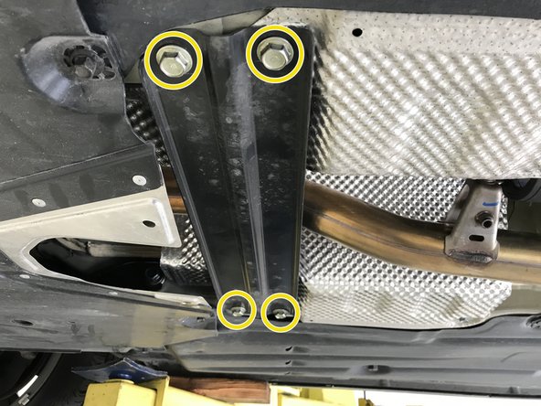 Use 14mm socket &amp; ratchet to remove the 4 bolts holding the cross member