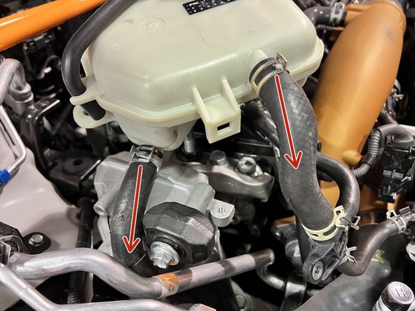 Use needle nose pliers to squeeze and slide back clamps on both upper and lower coolant hoses
