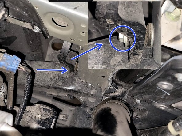 One is in fender well area. Use a 10mm socket  and 1/4&quot; ratchet to remove the one (1) nut as shown