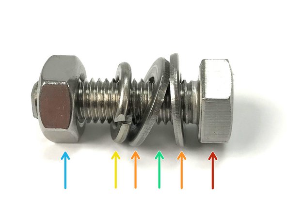 The location of the flat washers, flanges, and split lock washer are critical for proper fastening and vibration resistance.