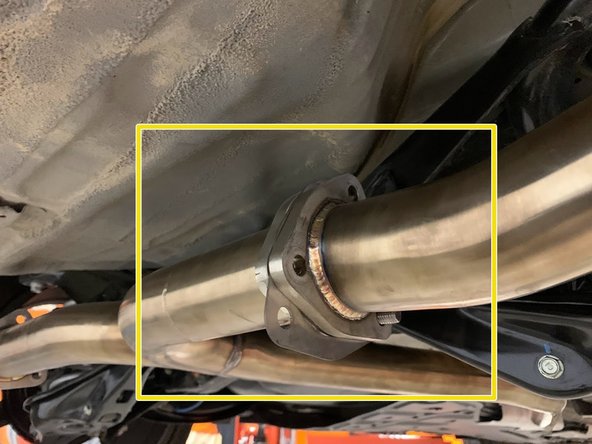 In one go, insert a provided &quot;tri-bolt&quot; gasket between the rear mid-pipe flange and the muffler flange then insert a bolt and washer to hold the sections together