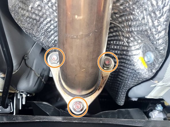 Remove three (3) nuts securing front pipe to down pipe using 14mm socket and ratchet