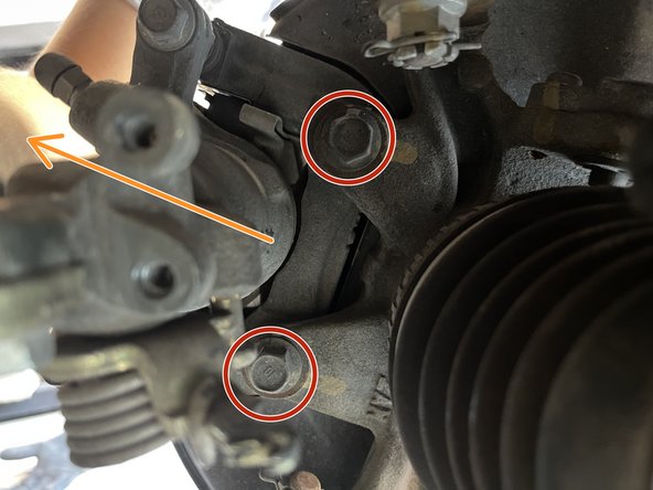 Using 14mm socket and 3/8&quot; breaker bar, remove the (2) 14mm bolts holding the caliper bracket to the knuckle