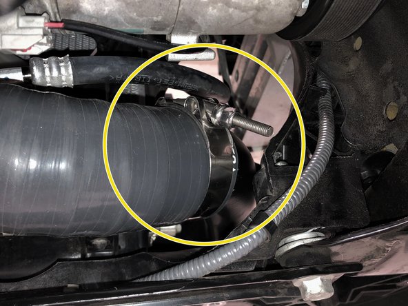 Secure the 27WON hot side bracket using the OEM hardware removed earlier. Tighten until snug using a 10mm socket and ratchet