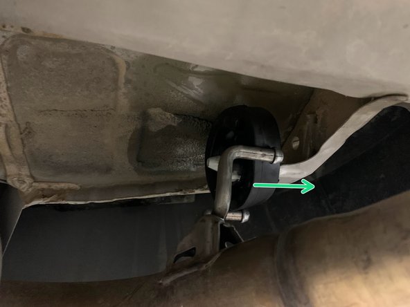 Using a spray cleaner, lubricate the rear hangers and rubber supports