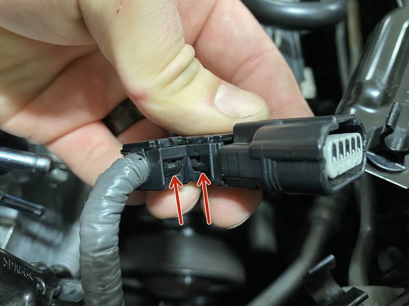 Using a small flat head screwdriver, pry the tabs out