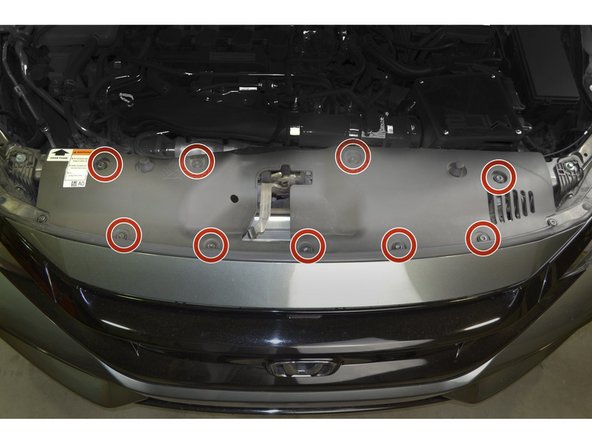 Reinstall radiator fan guard by inserting the 9 plastic clips and pressing down on them with your thumb