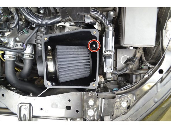 Aline the inner hole with the hole in the rubber dampener and insert the provided hex head M6x8mm bolt. Tighten using a 10mm socket with an extension and a ratchet