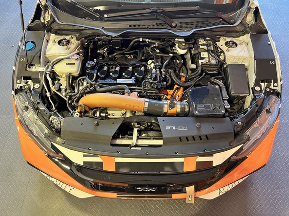 Place the shroud onto the header panel lining up all of the holes as shown