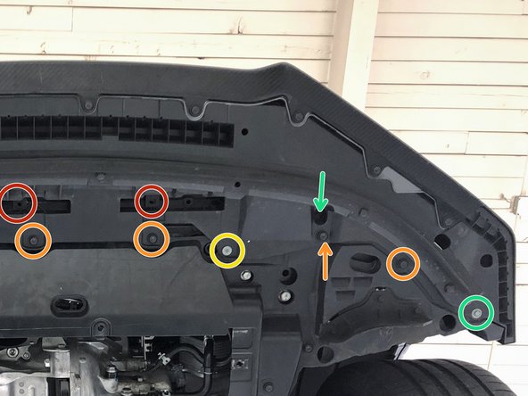 From the underside of the front bumper, reinstall: