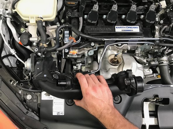 Move the TIP towards the passenger side of the vehicle past the oil dip stick