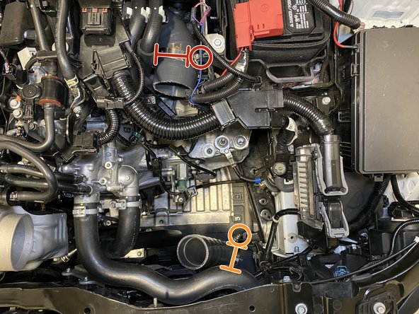 Place a 79-87mm T-Bolt clamp onto the throttle body silicone.  Position the nut on the driver side facing up as shown for easy access