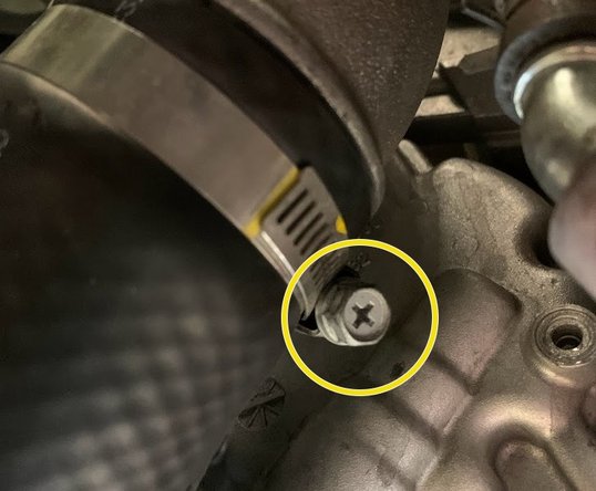 Free the boost tube from compressor cover outlet