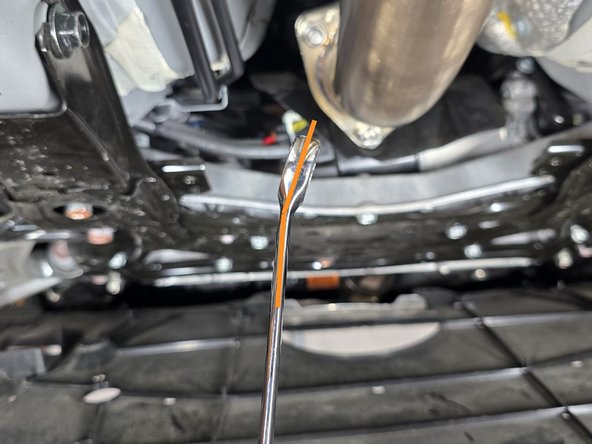 To make this as painless as possible, you will need a 17mm wrench with a bent end as shown