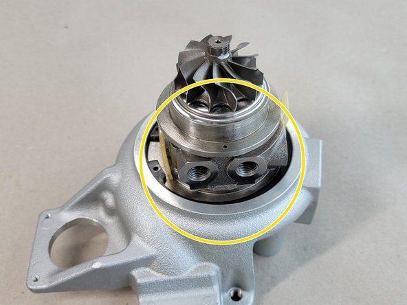 Check the snap ring all the way around the CHRA to be sure it is seated correctly as shown