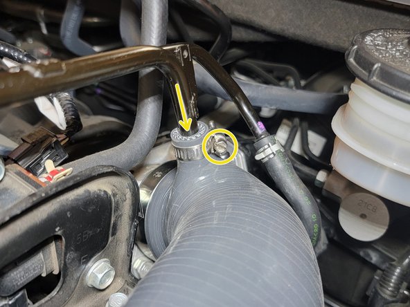 Reinstall the hard breather line into the SRI and tighten the provided worm drive clamp with a flat head screw driver