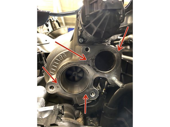 Using a spray glass cleaner (or equivalent) and rag, clean the surface of the compressor housing face