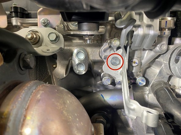 Using a 1/4&quot; ratchet with a 4&quot; extension and a 10mm socket, remove the one (1) 10mm bolt securing the secondary O2 wiring bracket