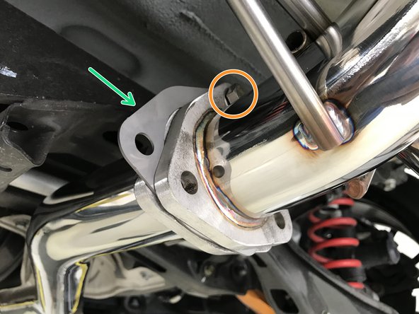 Install the provided tri-bolt gasket between the muffler section and the rear mid-pipe section as shown