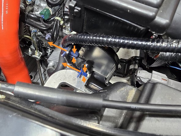 Using your hand or a pair of pliers pinch the top and bottom of the plastic clips holding the MAF loom to the ECU and push them out of the bracket as shown