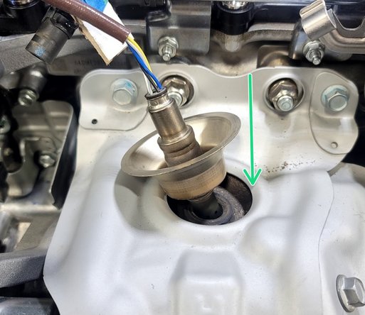 By hand, reinstall O2 sensor into turbine housing