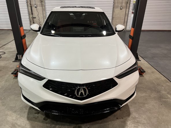 Clear space around the front of the car and underneath to have ample space to remove the front bumper