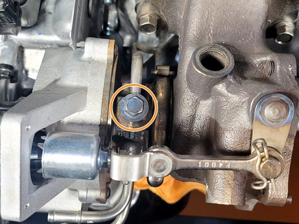 Use 12mm socket and ratchet to remove the oil feed banjo bolt