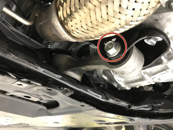 Using a 19mm socket and breaker bar, loosen the engine end RMM bolt indicated with red circle