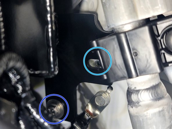 The plane of this mount is at an odd angle. Use extra caution not to cross thread. Washer not shown