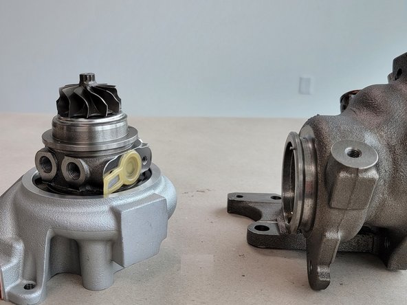 There is a locating pin between the CHRA and turbine housing