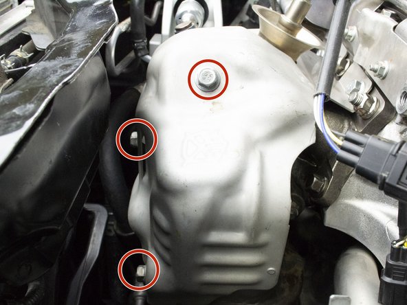 Use a 12mm wrench to install the three (3) 10mm OEM bolts and heat shield.  Torque to 15-19 ft-lbs