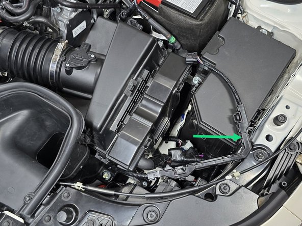 Unplug the connector for MAF sensor by using your fingers to press down on the plastic clip and pulling the plug away from the airbox as shown