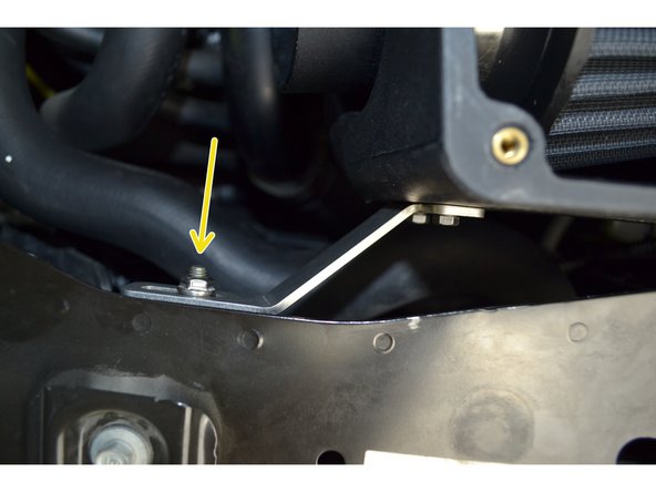 Thread the provided M6x1.0 flange nut onto the rubber isolator. The nut should be loose enough to allow the airbox to still slide within the slotted hole