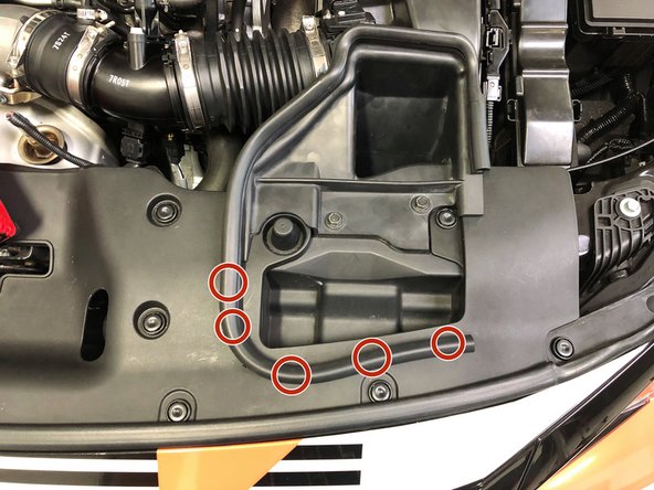 Begin by freeing the OEM weatherstripping from the upper radiator panel