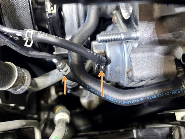 Slide these two (2) clamps up the Bypass Valve and Vacuum line hoses using needle nose pliers