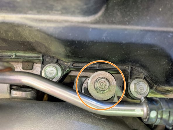 Undo 10 mm bolt on the inlet pipe  as shown