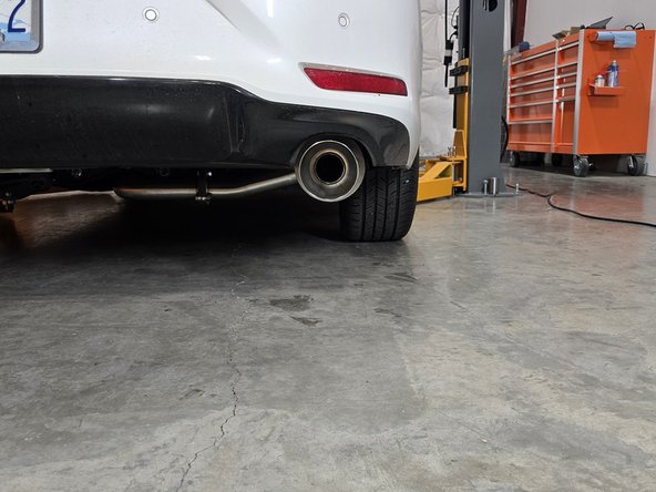 If the tip is sitting high, there may be a rubber hanger that is upside-down. Verify that all hangers are oriented correctly